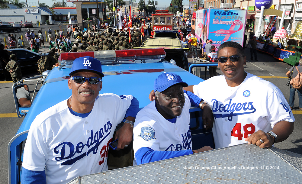 Derrel Thomas, "Sweet" Lou Johnson and Dennis Powell ride on top of the Dodger fire truck at today's 29th Annual Kingdom Day Parade.