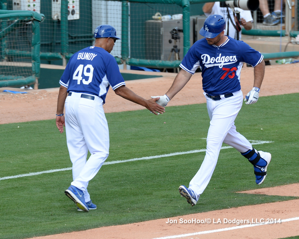 Lorenzo Bundy congratulates homer-hitting Clint Robinson in the eighth inning today. 