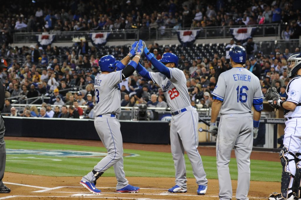 Carl Crawford congratulates Adrian Gonzalez at home plate in a game at San Diego on April 11. (Jon SooHoo/LA Dodgers,LLC 2013)