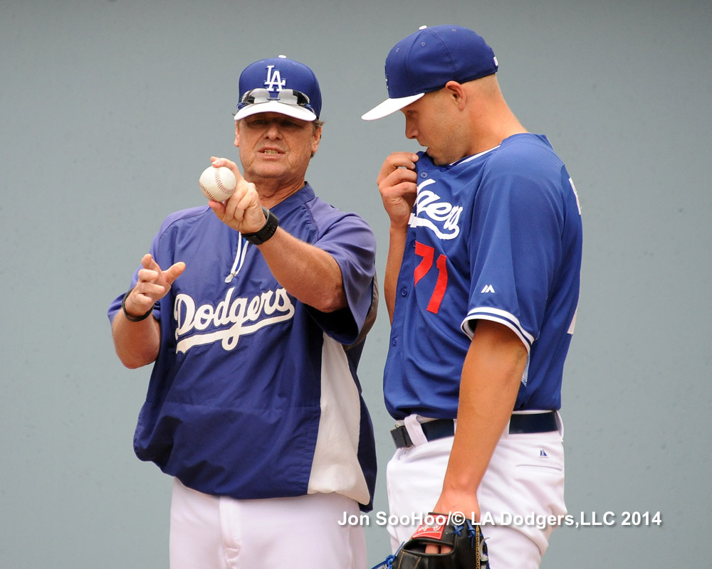 Pitching coach Rick Honeycutt counsels Rosin. 