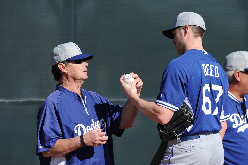 Pitching coach Rick Honeycutt with Chris Reed at Spring Training (Jon SooHoo/Los Angeles Dodgers)