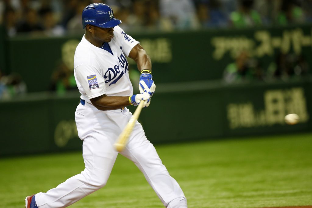 Puig connects on his third-inning double Sunday. (Yuki Taguchi/MLB Photos)