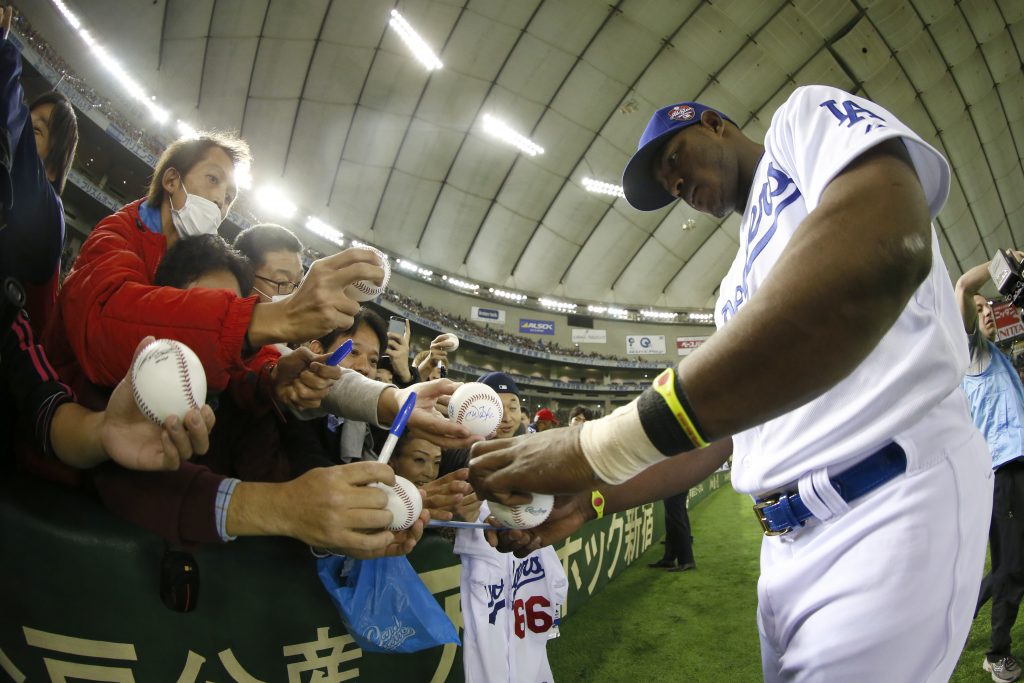 Yasiel Puig signing autographs before Sunday's game (Yuki Taguchi/MLB Photos) 