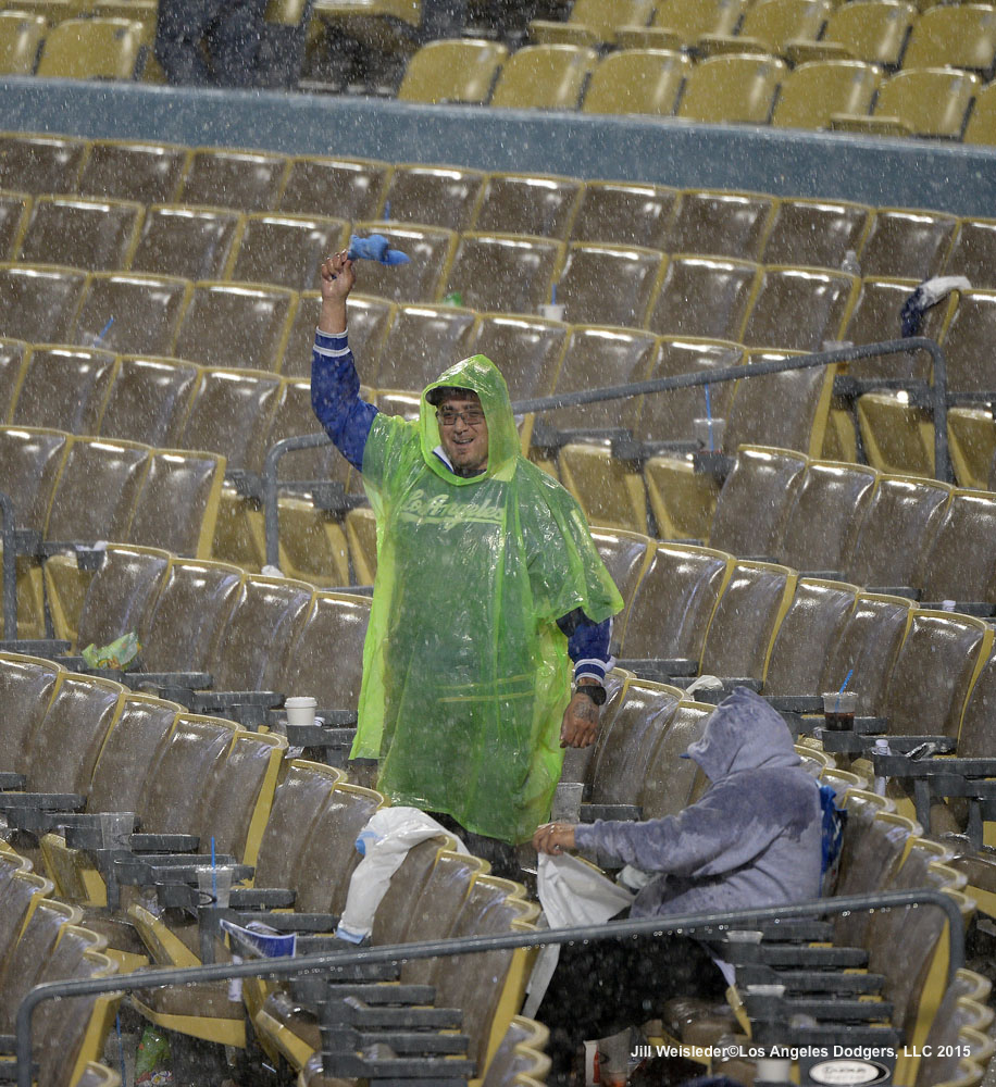 A sole Dodger fan shows his support during the rain delay. Jill Weisleder/LA Dodgers