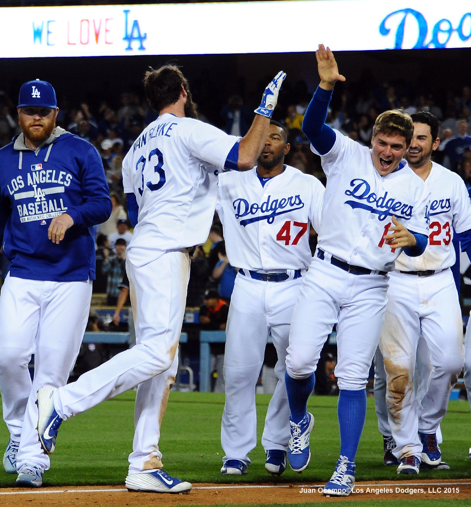 Scott Van Slyke is congratulated by his teammates after his game winning home run. The Dodgers beat the Marlins, 5-3