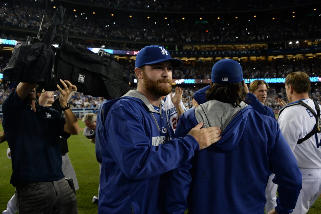 An injured Chris Withrow joined in the celebration of the Dodgers' NL West clincher in September. (Jon SooHoo/Los Angeles Dodgers)