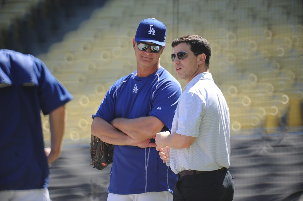 Don Mattingly and Andrew Friedman chat at an October 7 workout. (Jon SooHoo/Los Angeles Dodgers)