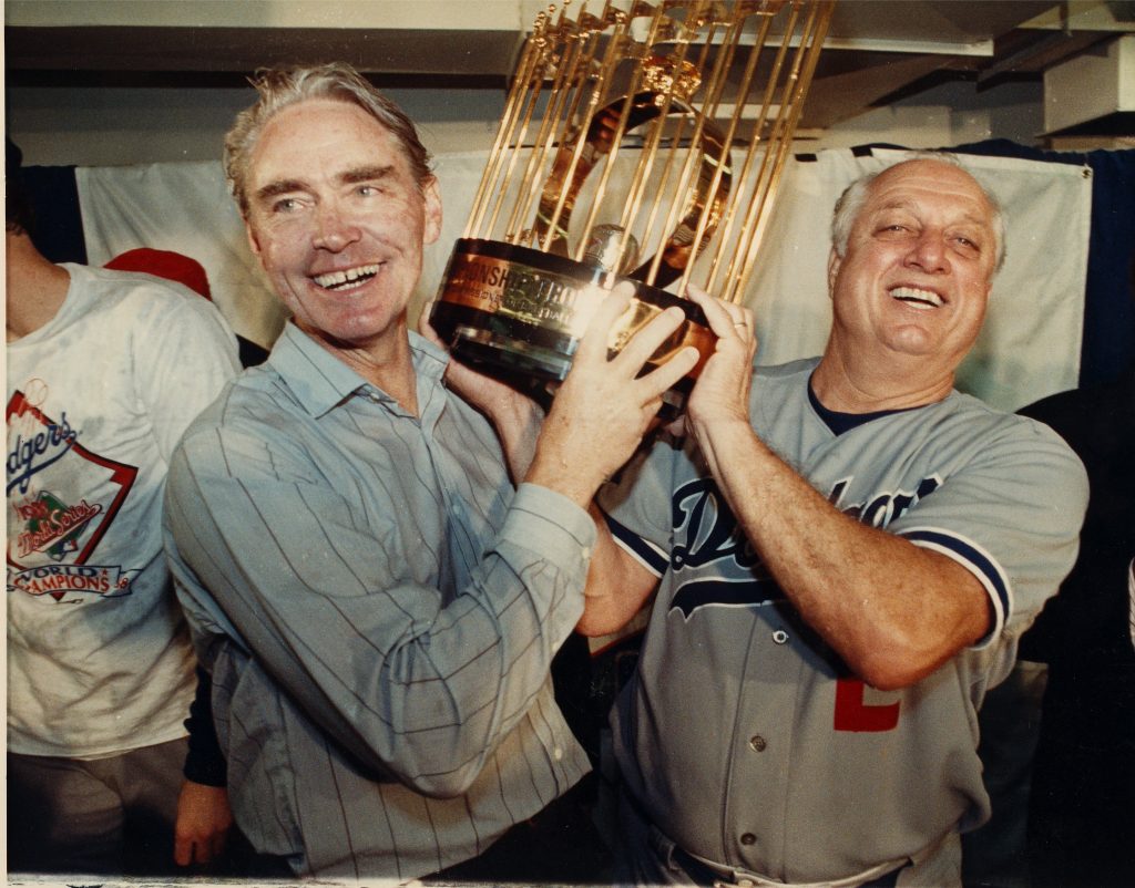 Tommy and Fred Claire with World Series trophy 1988