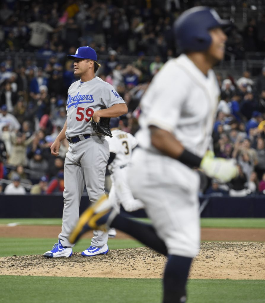 SAN DIEGO, CALIFORNIA - MAY 21: Chin-Hui Tsao #59 of the Los Angeles Dodgers stands on the mound after giving up a walk-off walk to Yangervis Solarte #26 of the San Diego Padres during the 11th inning of a baseball game at PETCO Park on May 21, 2016 in San Diego, California. The Padres won 3-2. (Denis Poroy/Getty Images)