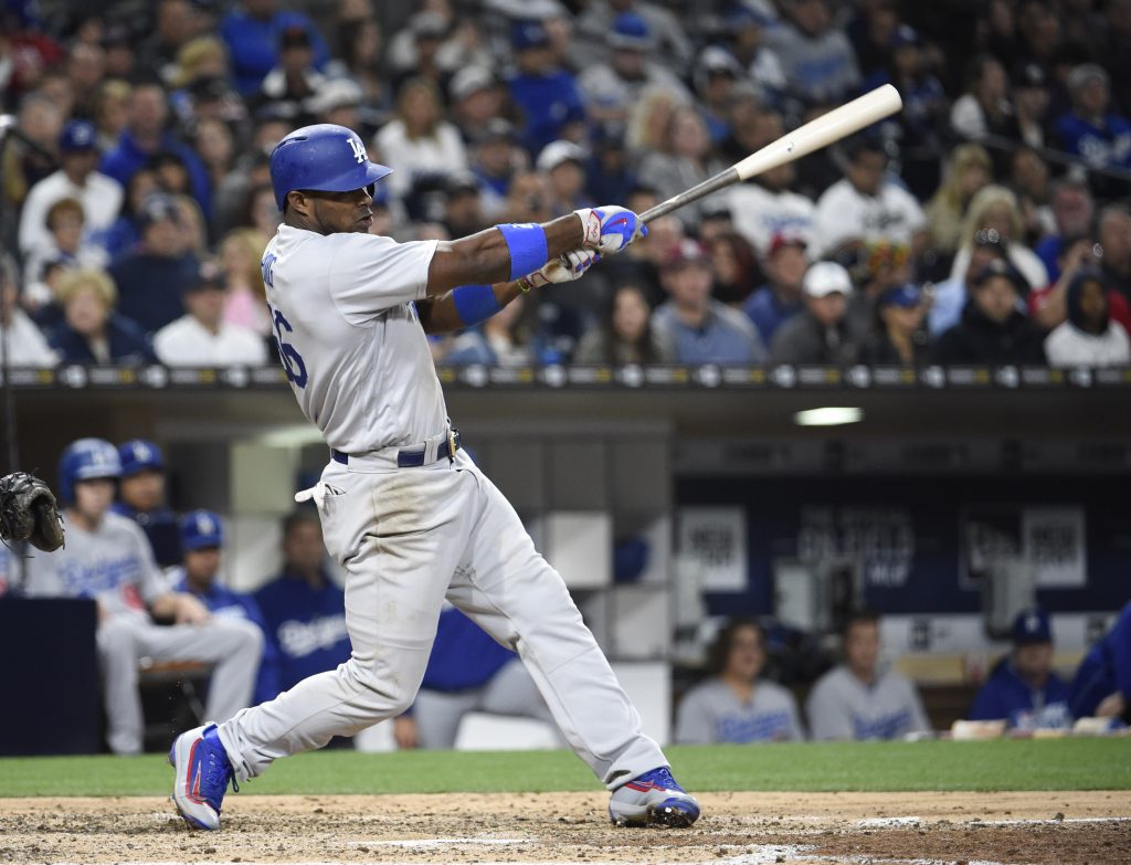 Yasiel Puig homers in the fifth inning. (Denis Poroy/Getty Images)