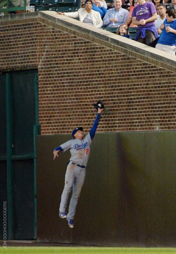 Trayce Thompson leaped near the bricks along the right-field foul line for this catch in the bottom of the fourth. 