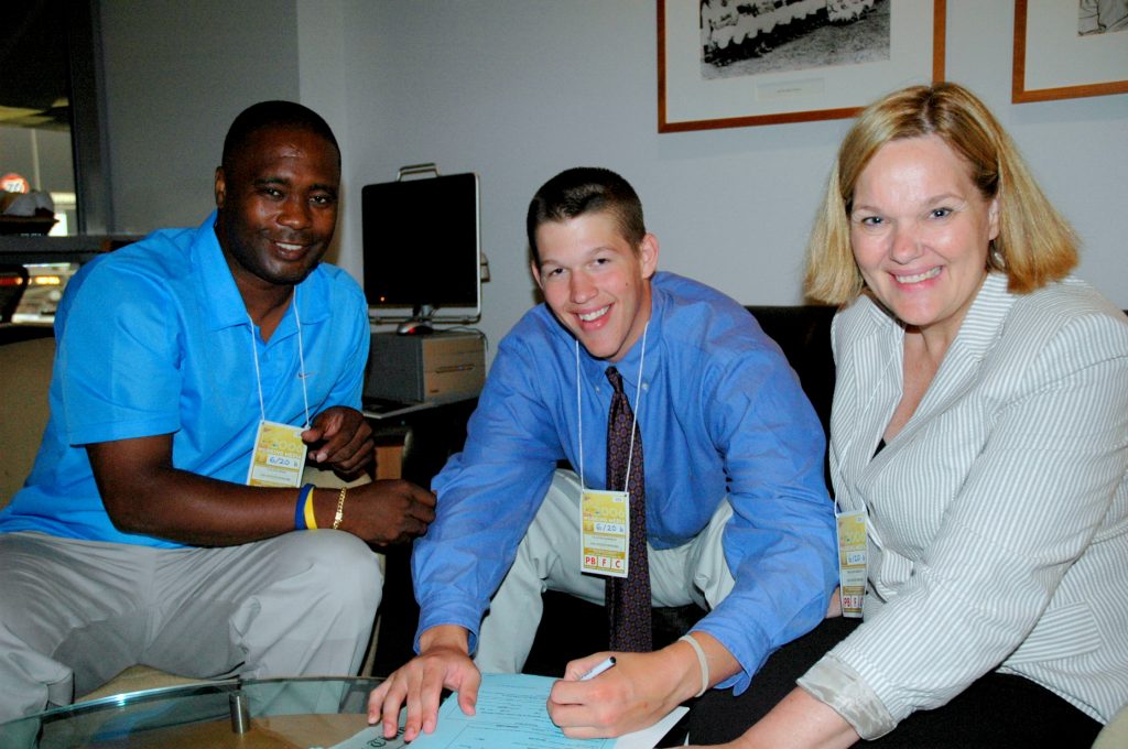 Flanked by Dodger scout Calvin Jones and his mother Marianne, 18-year-old Clayton Kershaw signs with the Dodgers. (Ben Platt/MLB.com)